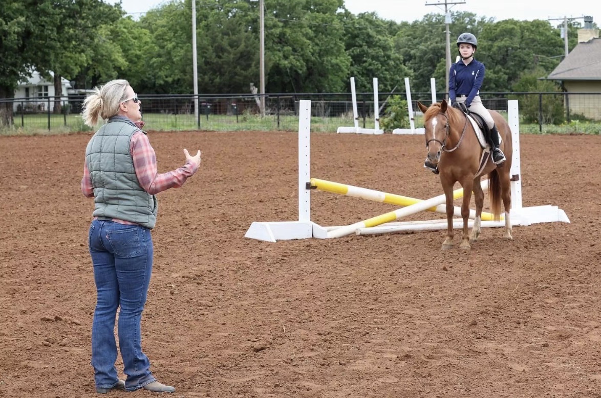 Riding lesson in the arena